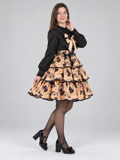 Black and orange witch costume with a puffy skirt