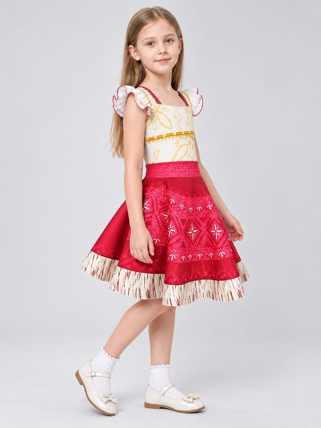 Dress with a white bodice, red skirt, and fringe