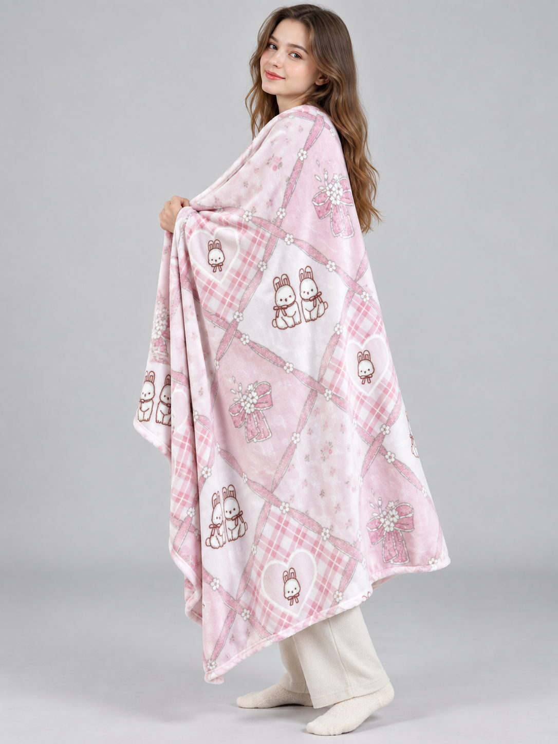 Reversible pink and white blanket with bunnies and bows