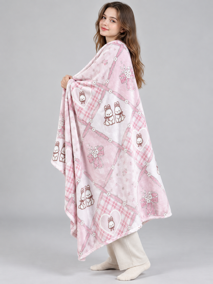 Reversible pink and white blanket with bunnies and bows