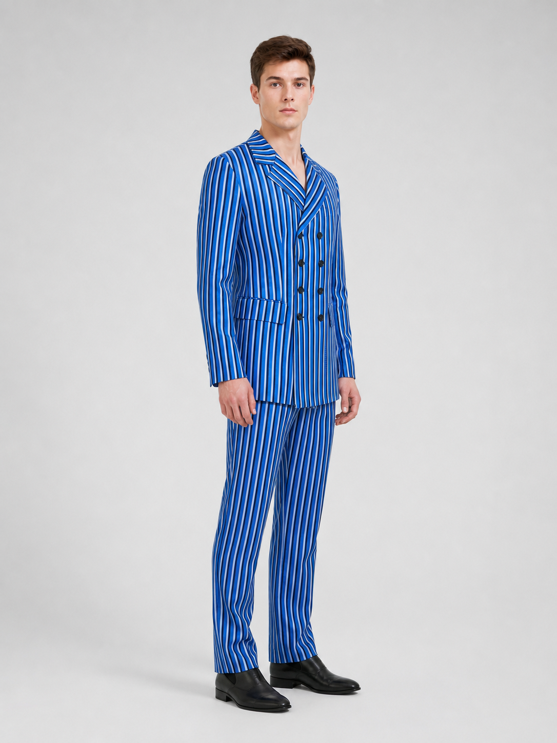 The Doctor Who cosplay double-breasted suit is designed in a white-and-blue color scheme with vertical stripes. The set includes a jacket and pants made in the same design. The jacket features a double-breasted closure, peaked lapels, and f