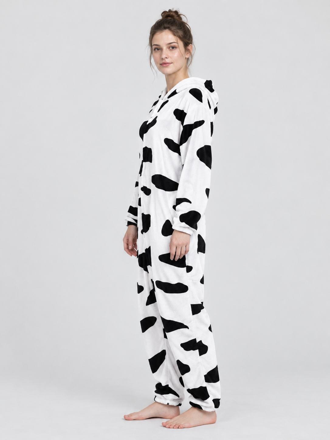 White pajama jumpsuit with black spots and a hood