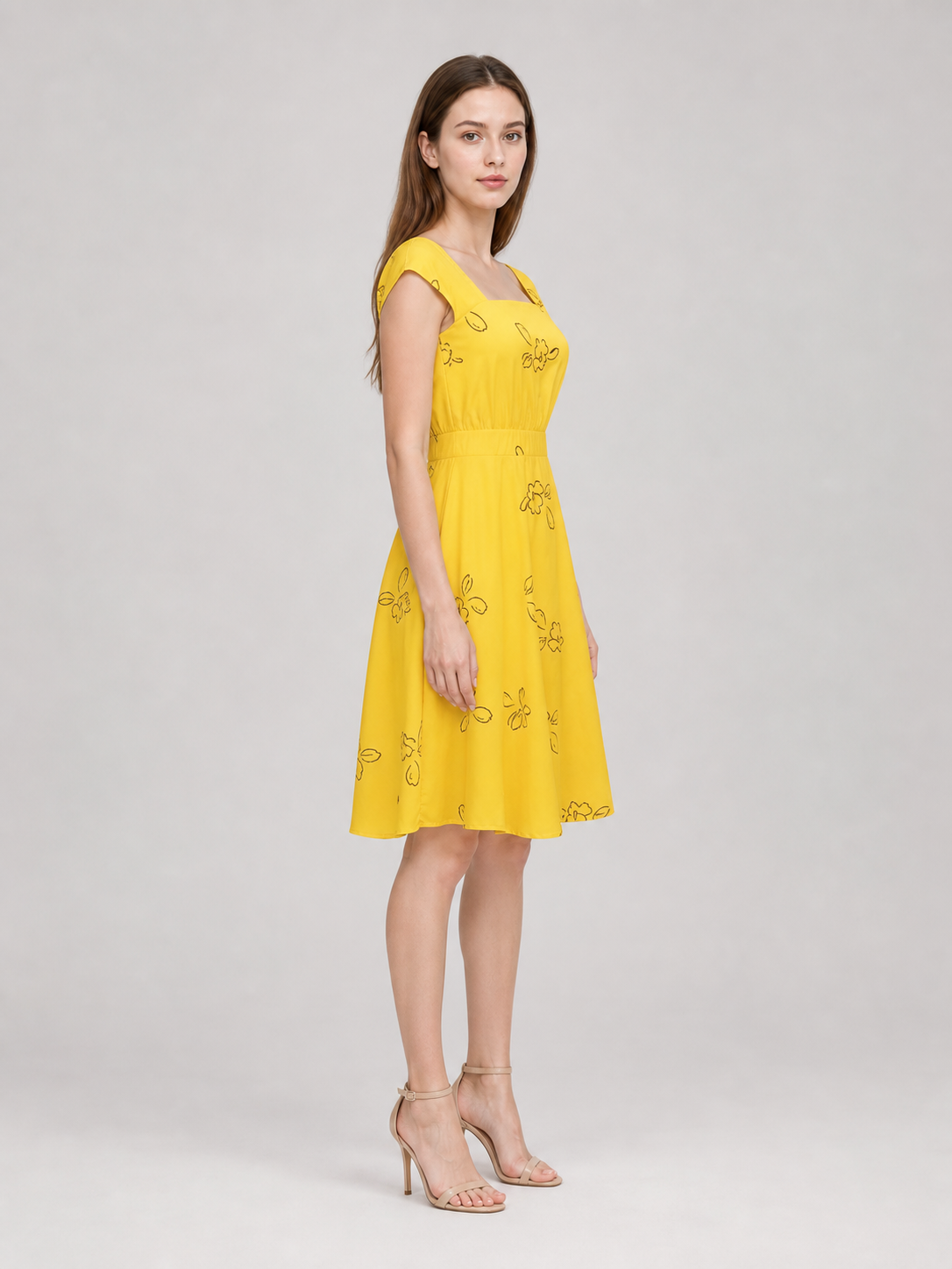 The dress is designed to recreate Mia's look from the film "La La Land" and for theatrical role transformations in a cosplay style. The model is made in a bright yellow color and decorated with a scattered outline pattern of flowers and lea