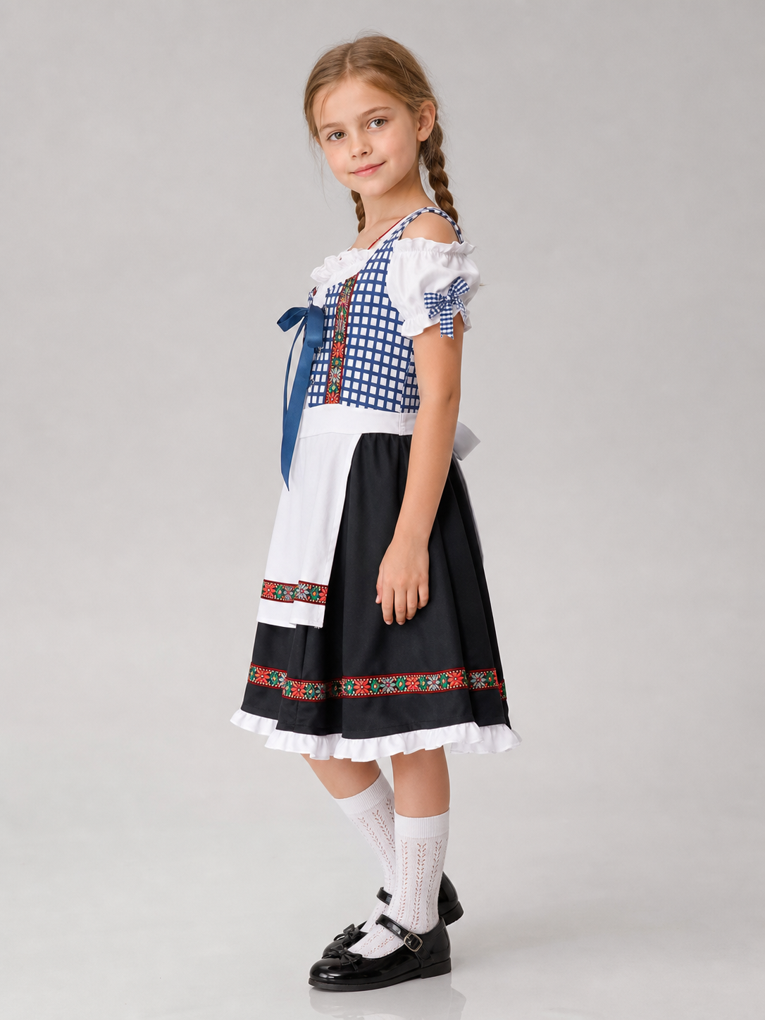 Historical national costume featuring a blue-and-white check pattern with a black lower panel. The design includes a white apron front and long blue lacing on the chest. Red-and-green ethnic patterns adorn the decorative shoulder bands, wai