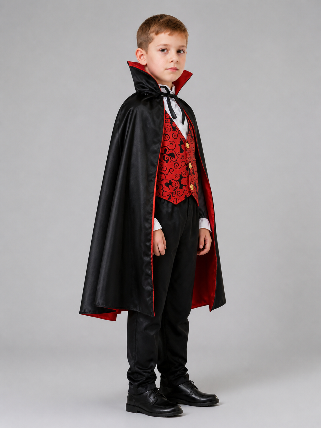 Children's vampire costume with cape, vest, and pants side view