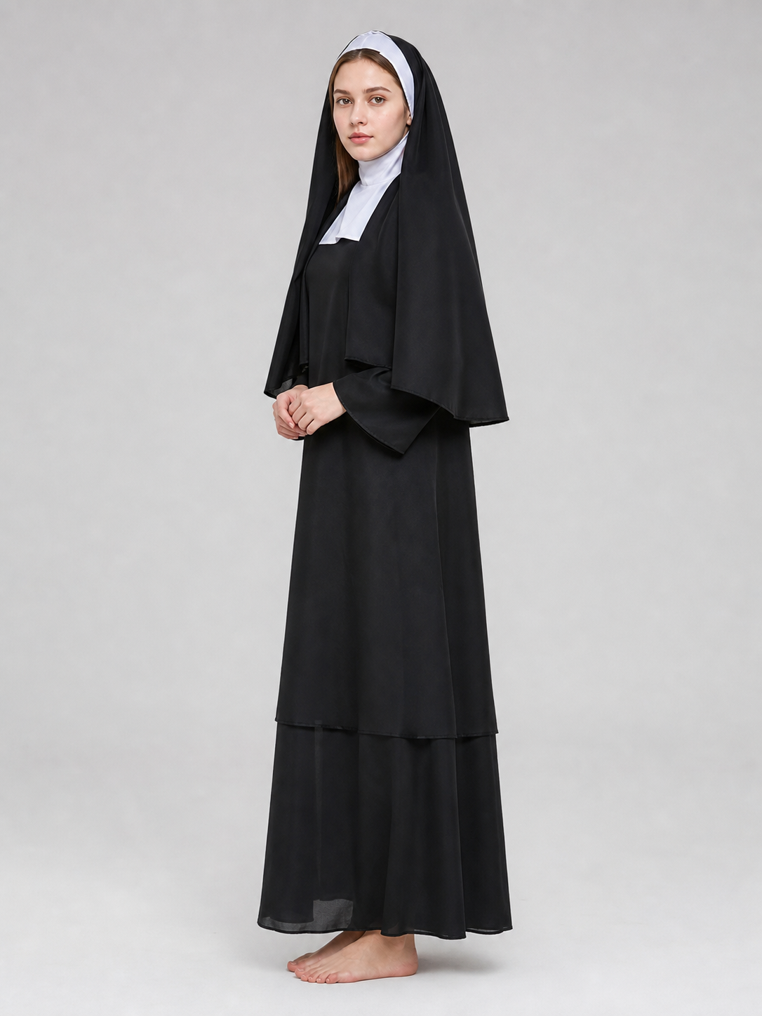 The costume consists of a religious and ceremonial robe in a black-and-white side view