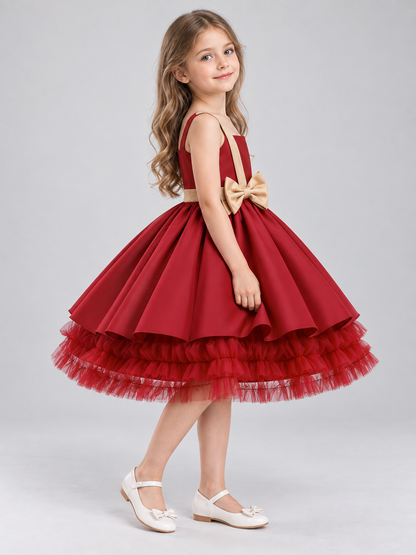 Burgundy sleeveless dress with gold bow and full skirt