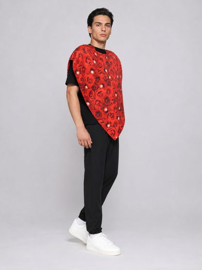 Bright heart-shaped costume with a floral print. A voluminous silhouette with a pointed lower edge and wide short sleeves that extend from the sides of the garment. The surface is decorated with an allover floral pattern reminiscent of rose