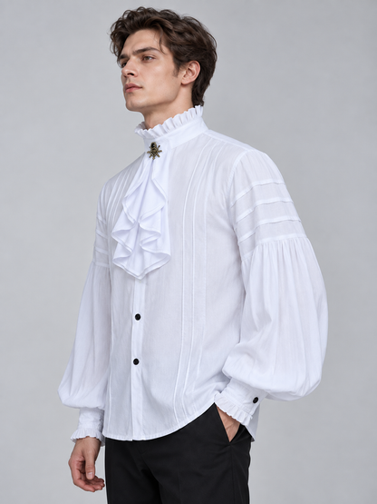 White shirt with a high collar, ruffles, and a brooch