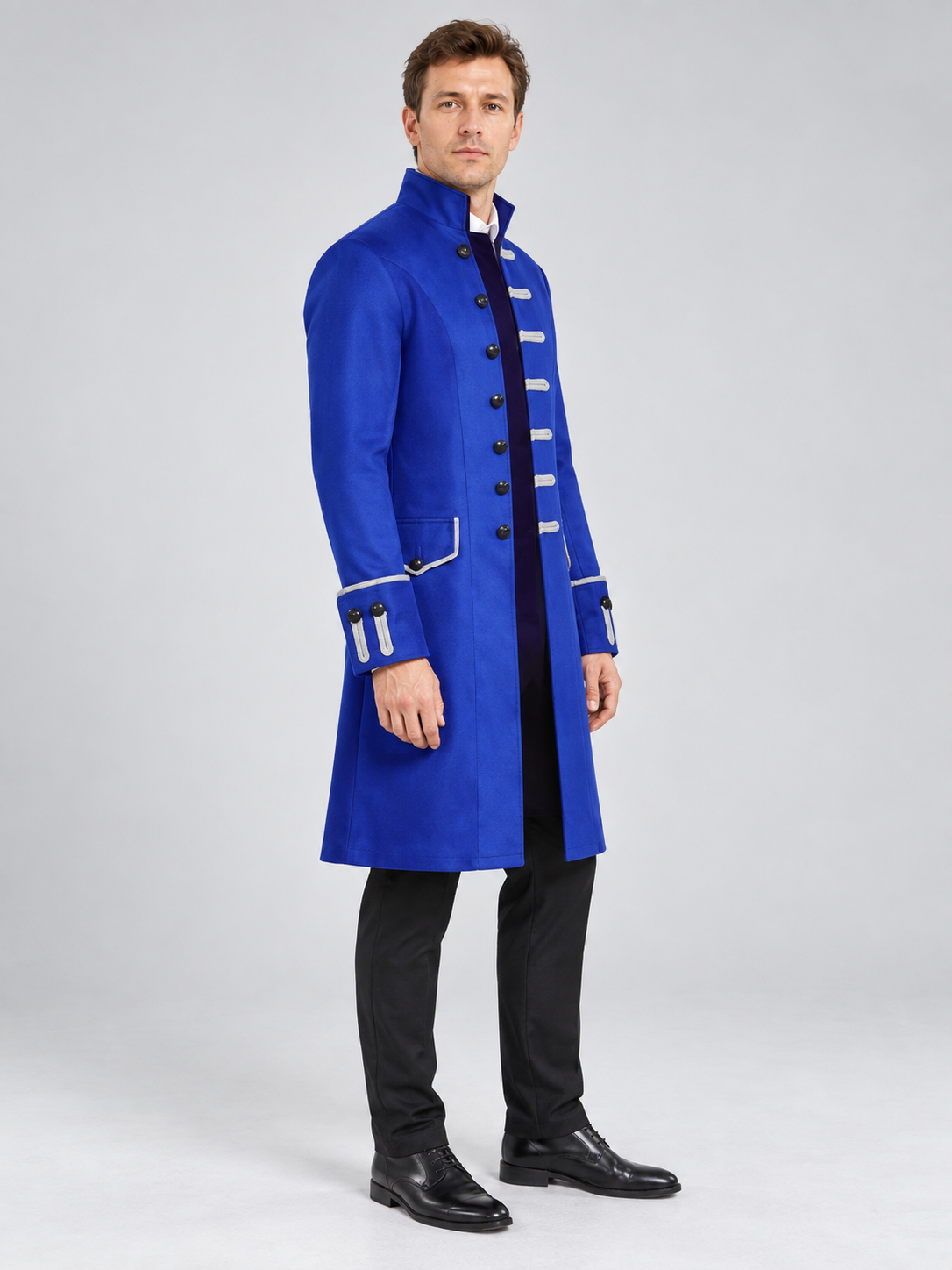 Long blue frock coat with black trim and stand collar