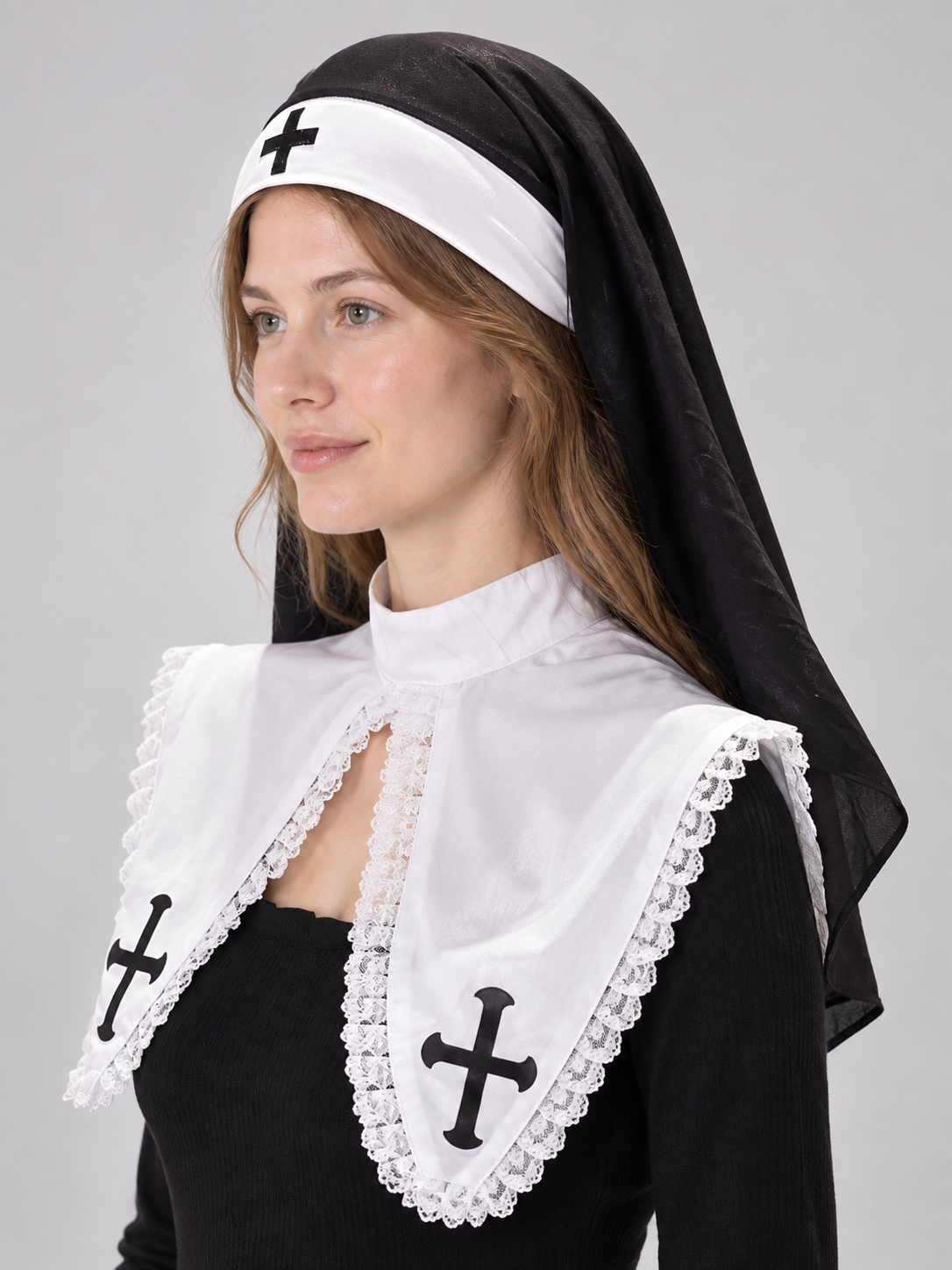 Black and white nun's headpiece with cross and veil