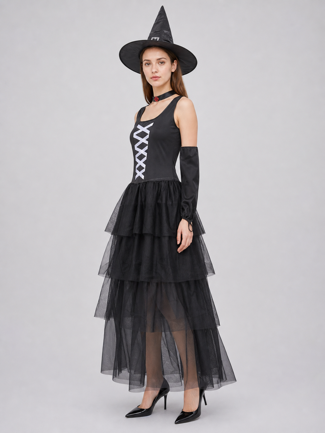 The set includes a black sleeveless dress, a pointed witch hat, separate side view