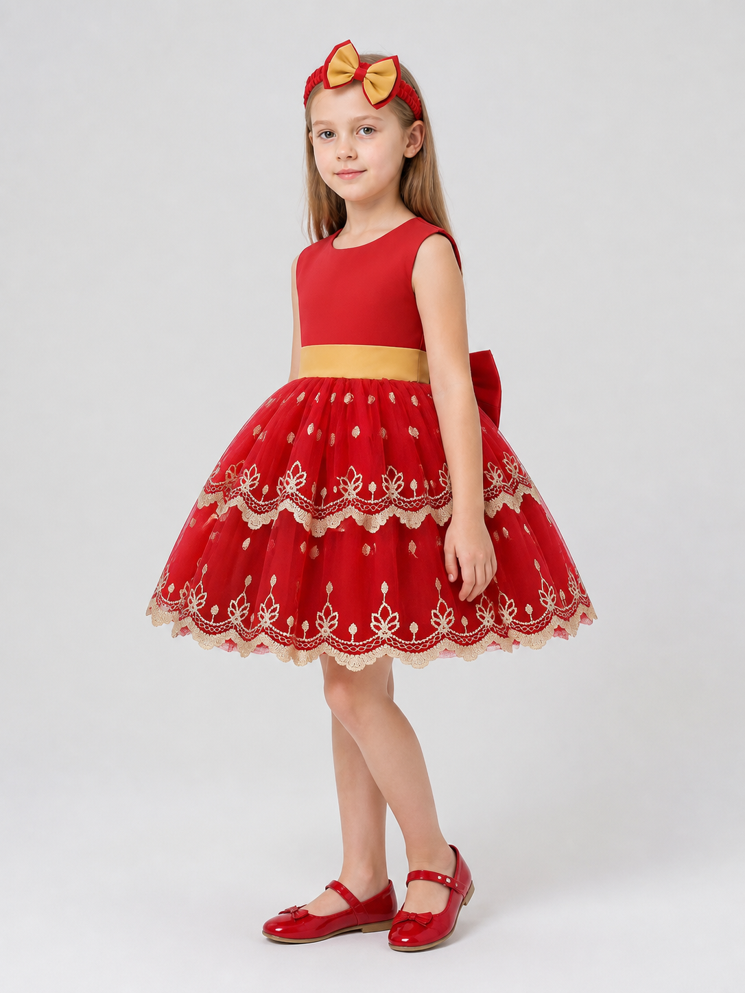 Children’s princess dress with a full skirt and gold embroidery side view