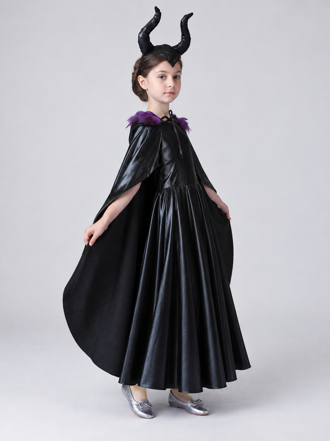 Costume: black dress, cape, headband with horns