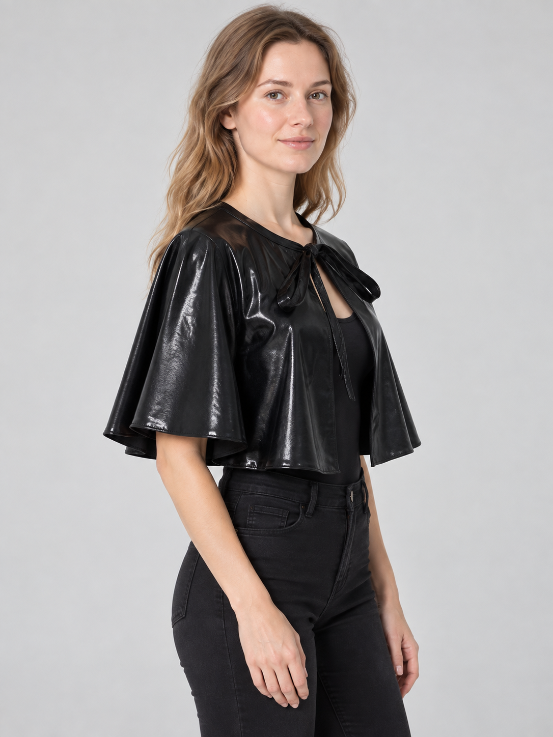 Short black shiny cape with ties