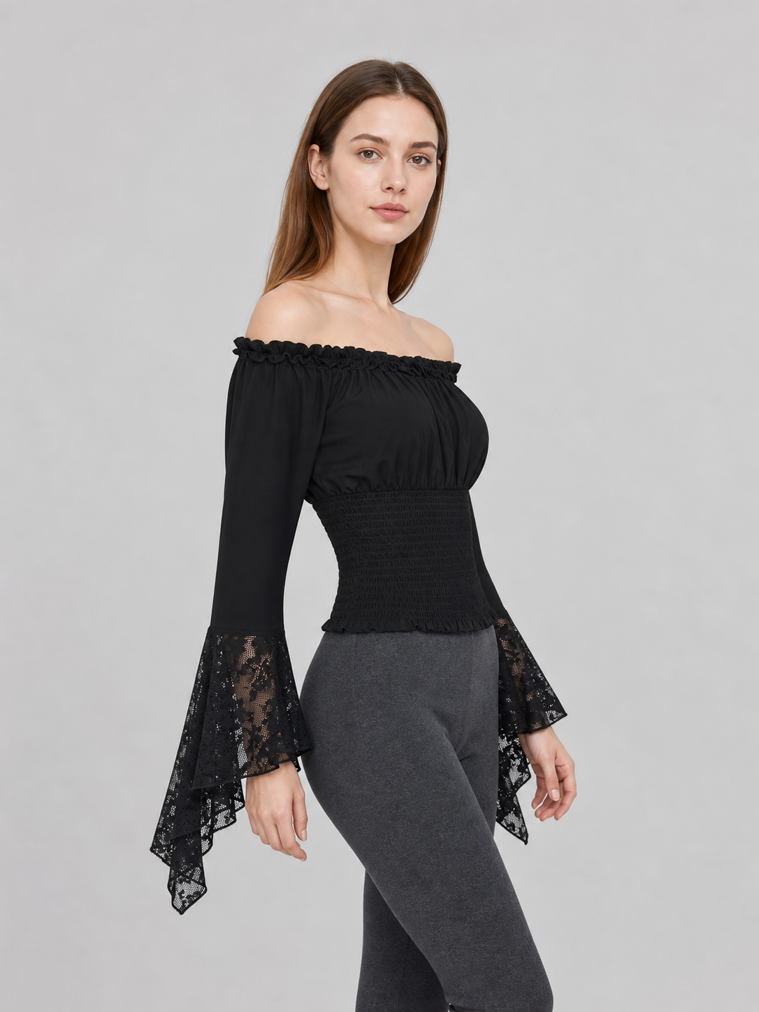 Black off-the-shoulder blouse with ruffles and long sleeves