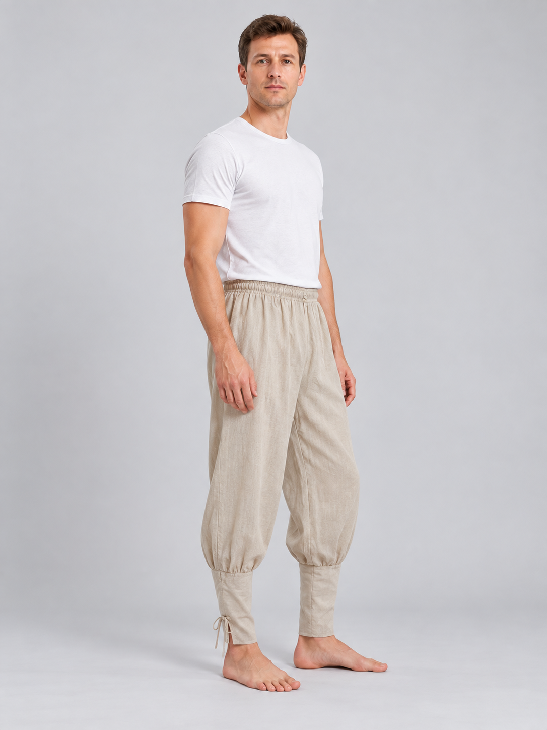 Beige long loose pants with ties at the cuffs