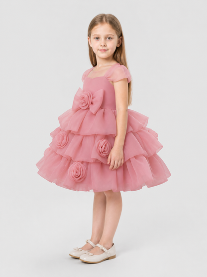 Full-skirt dress with roses for a flower girl at a wedding side view