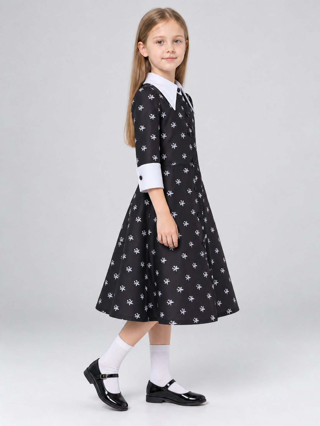 Children's costume dress with a white bow print side view