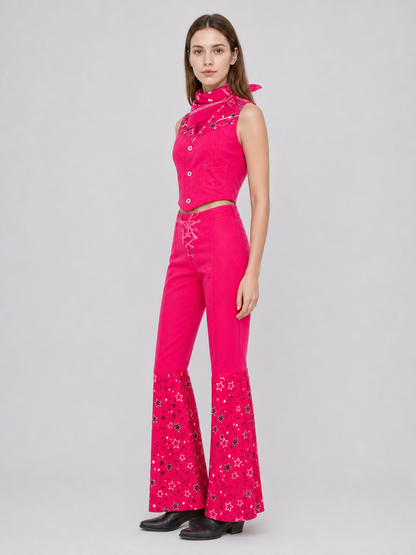 Barbie-style cosplay set consisting of two pieces: a cropped sleeveless top and flared-leg pants. The top resembles a vest with a front button closure, a decorative yoke, and a styled collar area. The pants have a high waist, front lacing, 