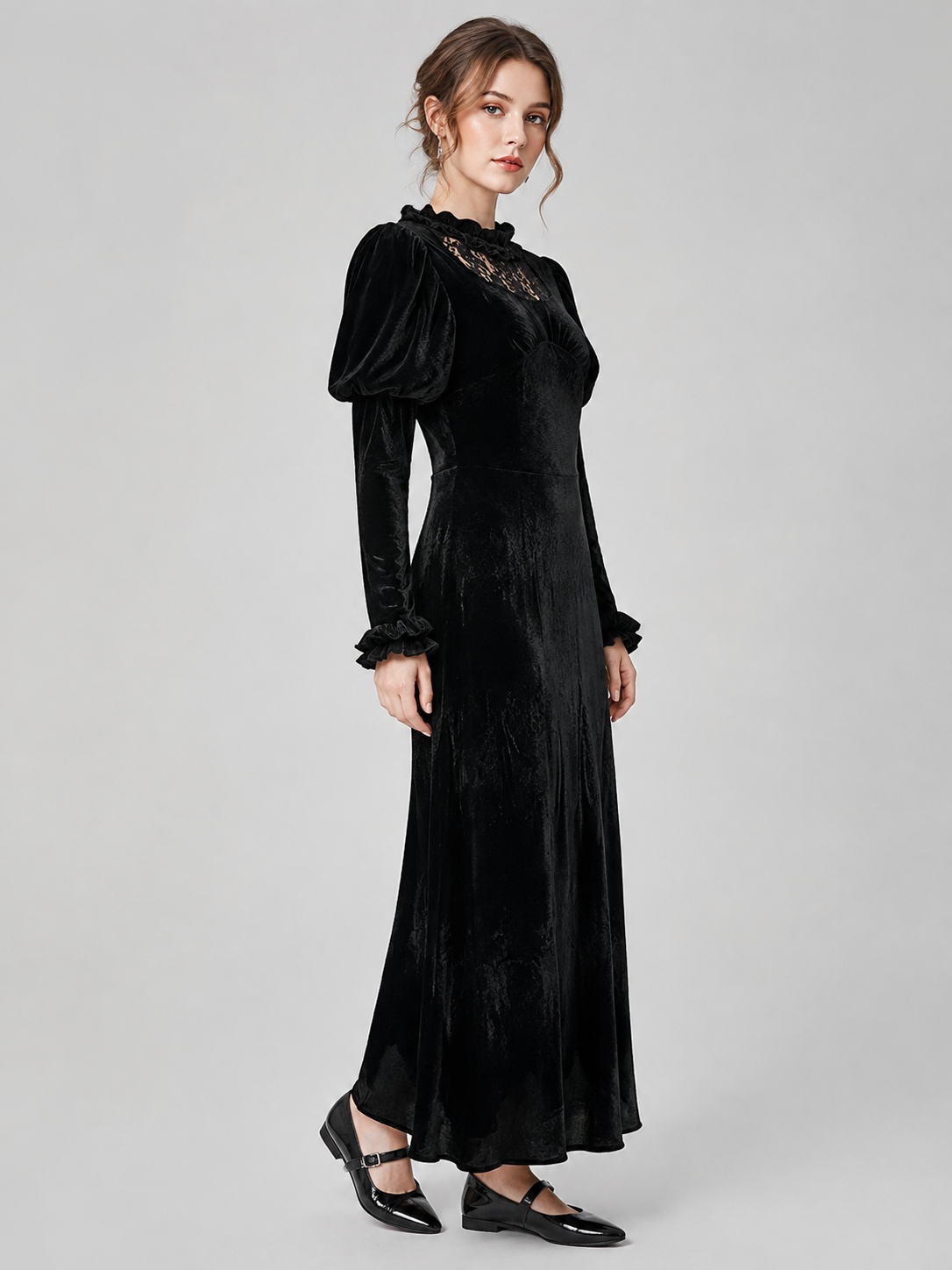 Long black corduroy dress with puff sleeves side view