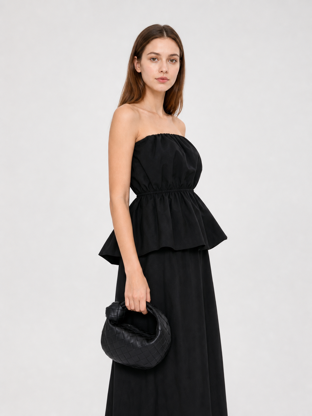 Black bandeau dress with a ruched bodice