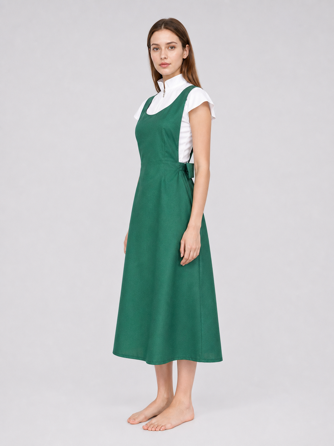 The green Kushina Uzumaki cosplay pinafore dress is designed in the recognizable style of the character from the anime Naruto: Shippuden. The design is a green pinafore dress with a square neckline, wide straps, and open pockets on the side