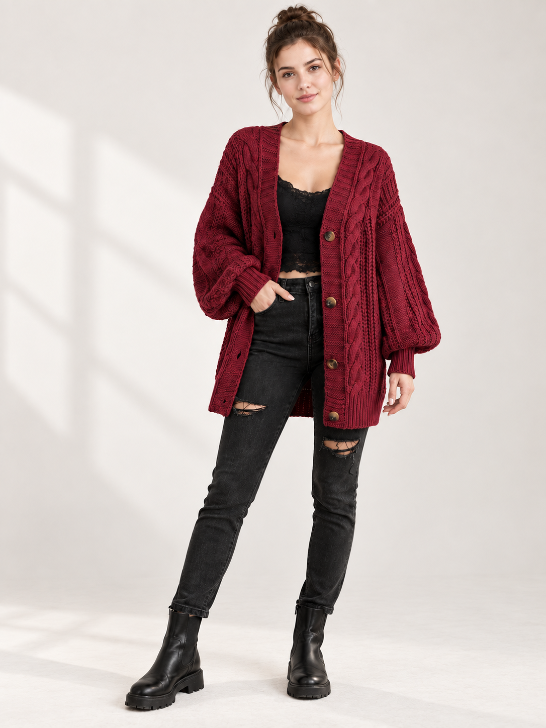 Dark red knitted cardigan with cable pattern and buttons