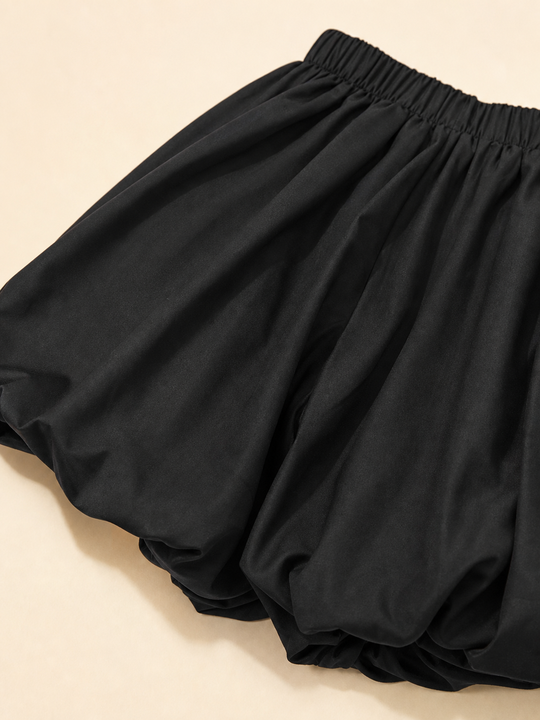 Mini skirt with a high elastic waistband and a full silhouette