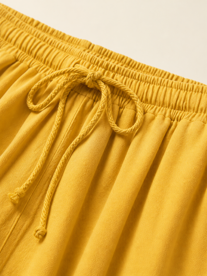 Mustard-colored wide-leg pants with long pant legs