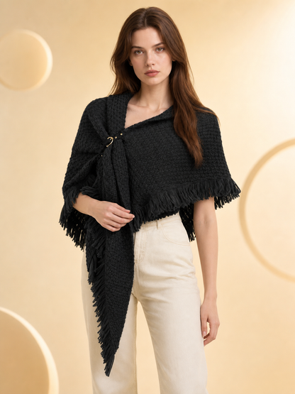 Black knitted poncho information card showing close-ups of the textured fabric, fringe, ring fastening, and draped construction