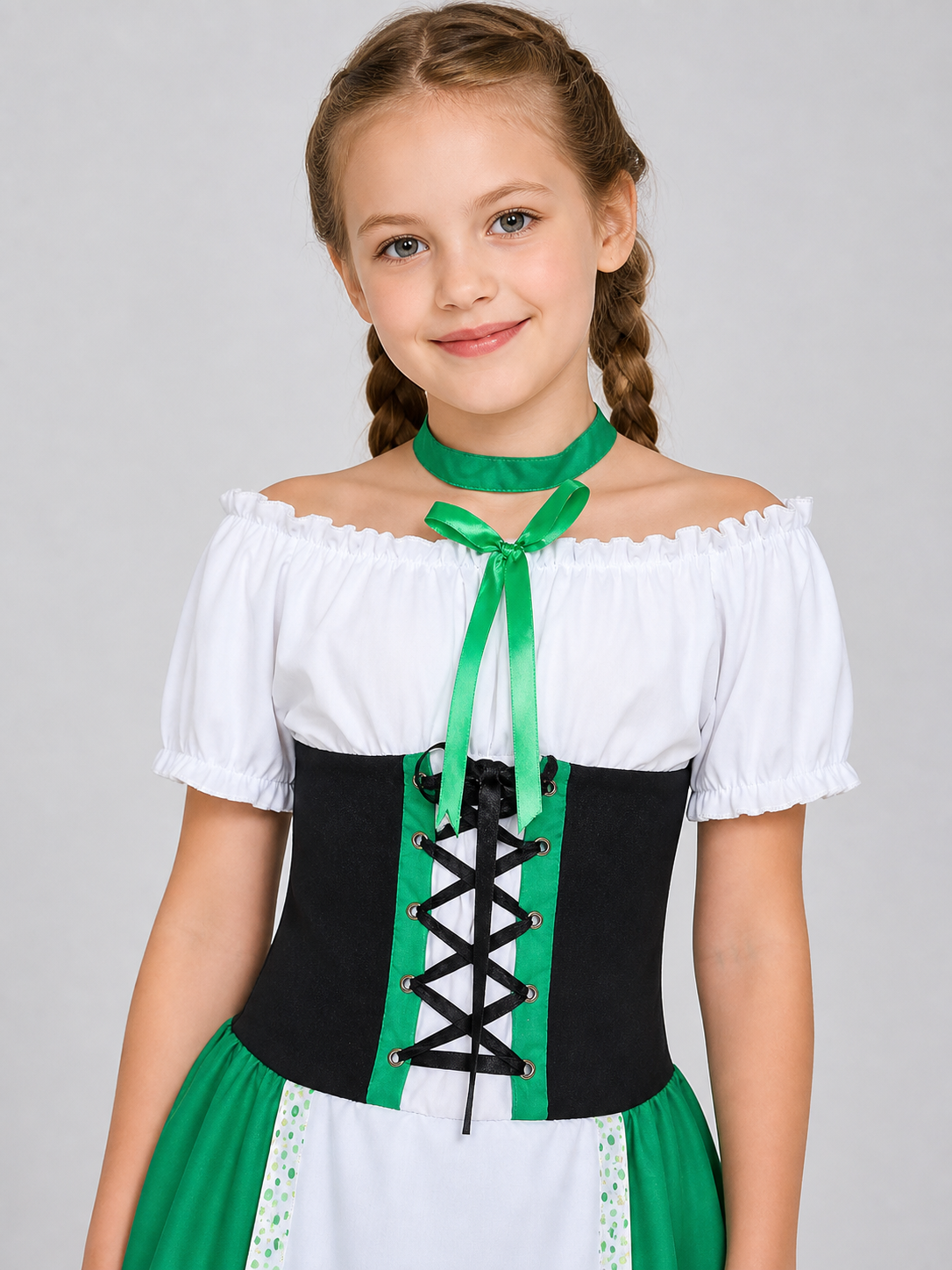 The dress is designed in a combination of white, green, and black. The silhouette emphasizes the waist and features a flared skirt. The design is finished with voluminous white short sleeves, a green tie collar, and green polka-dot trim. Th