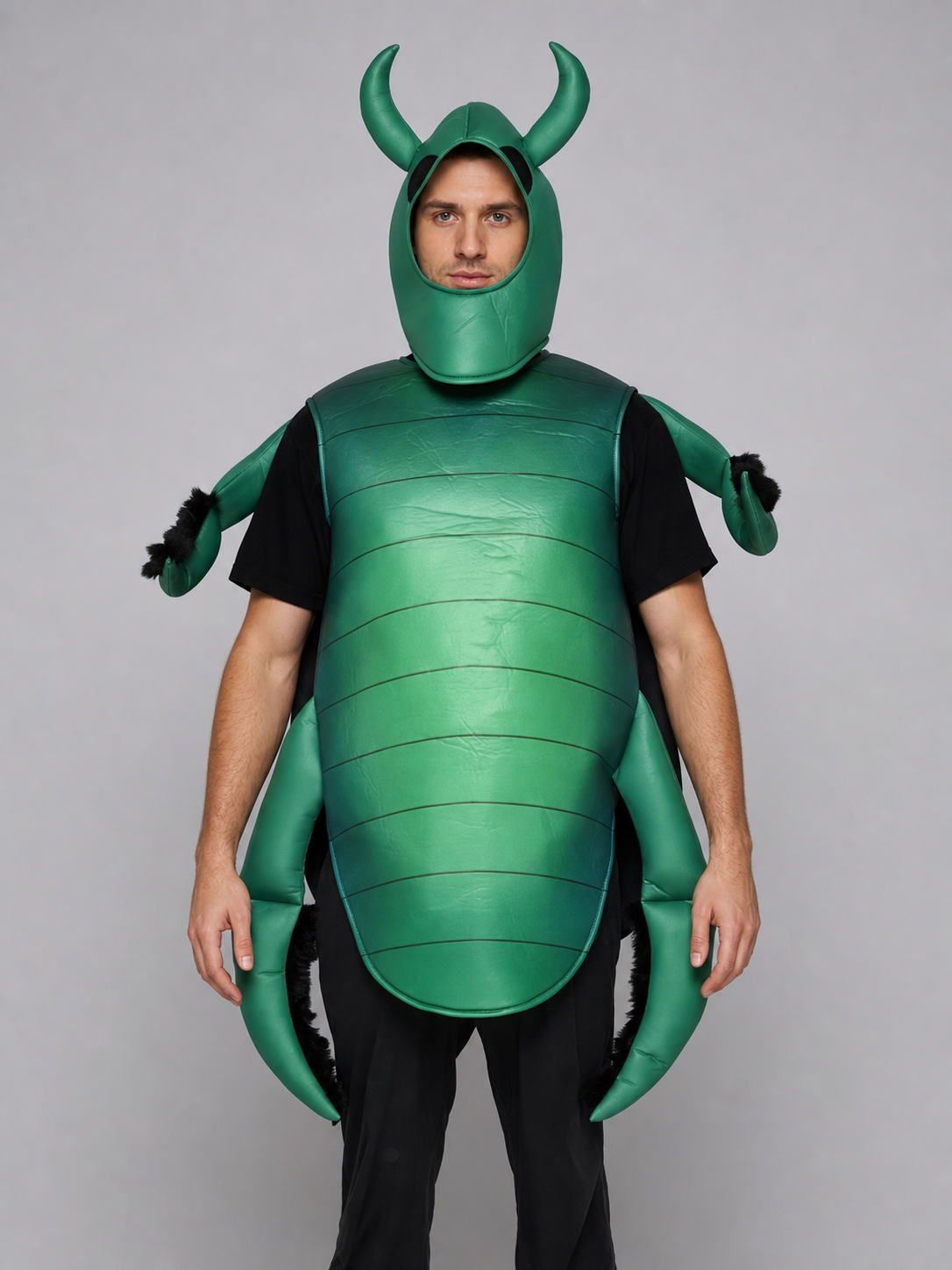 The beetle costume features a full-body insect silhouette with a large segmented green panel on the abdomen. The look is completed by a curved headpiece resembling horns, along with green side and hand elements that imitate insect limbs. Th
