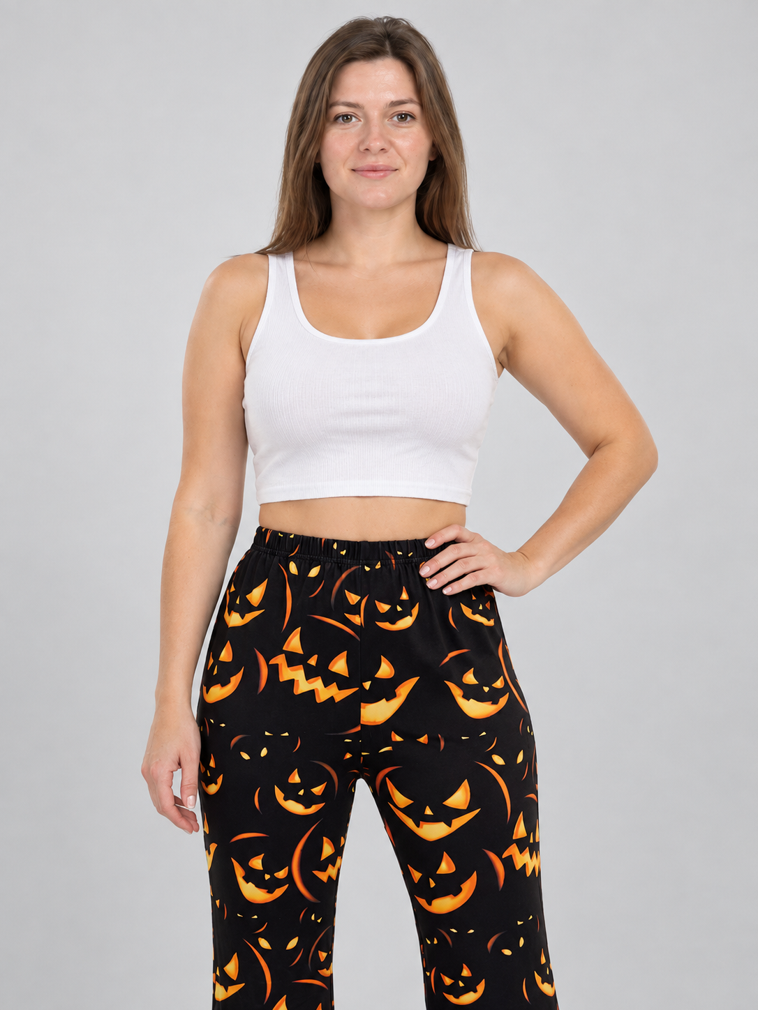 Black Flared Carnival Pants with Orange Smiling Pumpkin Print