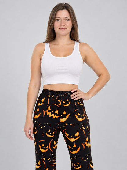 Black Flared Carnival Pants with Orange Smiling Pumpkin Print