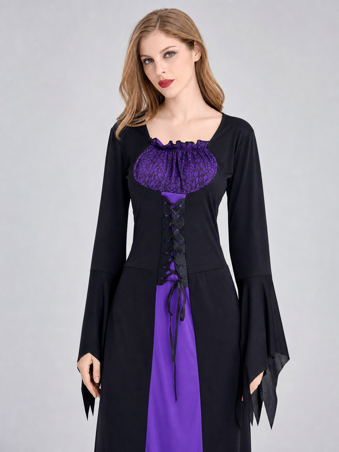 Cosplay costume designed as a long black and purple wizard-themed dress. The set includes a dress, a pointed wide-brimmed hat, and a collar. The design features long sleeves with flared cuffs, a fitted upper section, and a lace-up front. Th