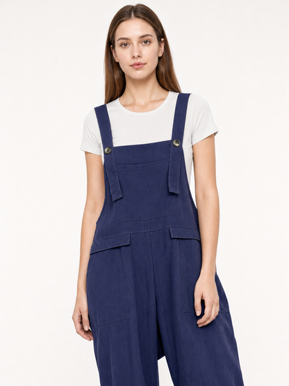 Loose-fit dark navy bib overalls with straps and pockets