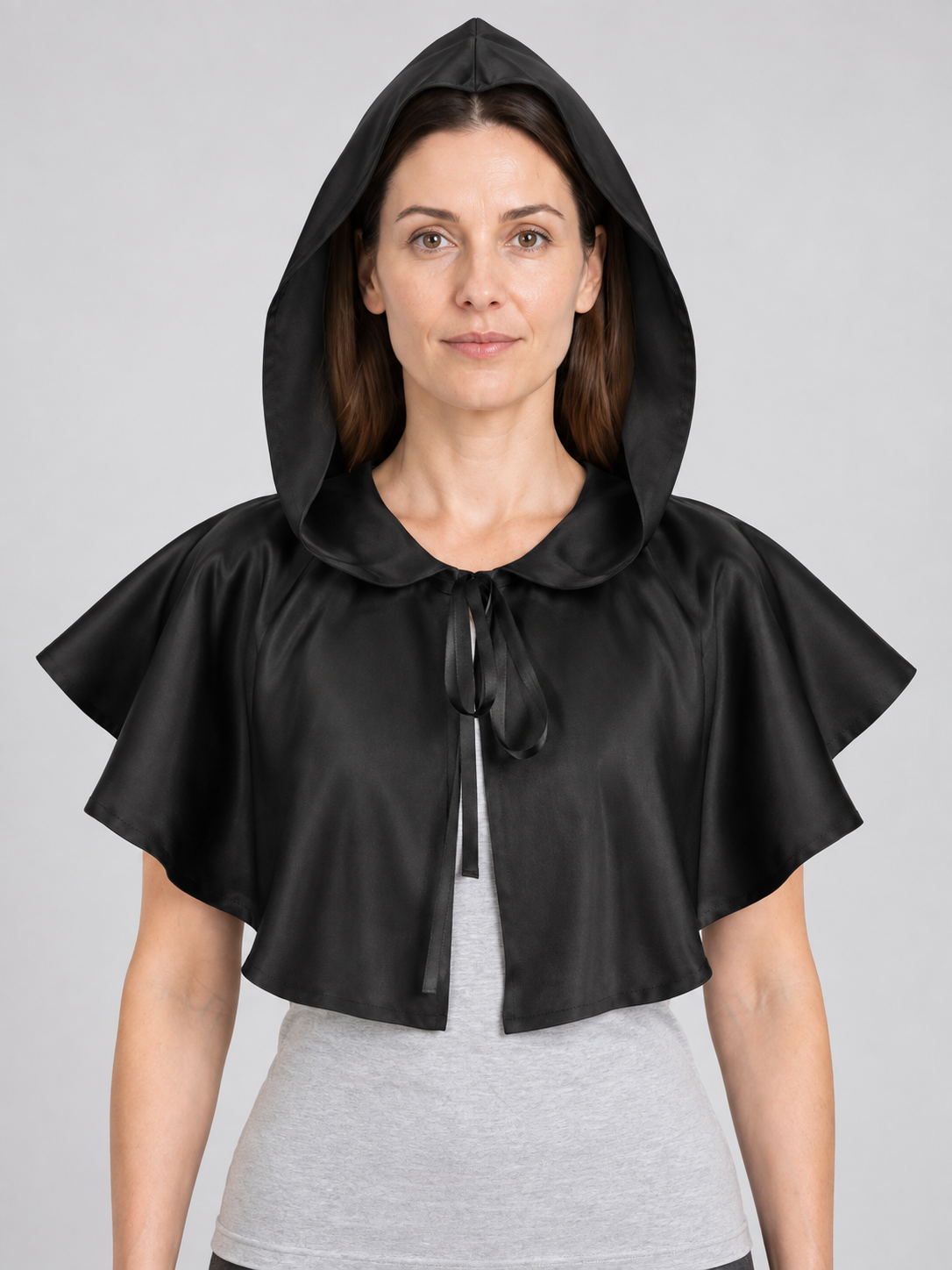 Black hooded cape with no sleeves and ties