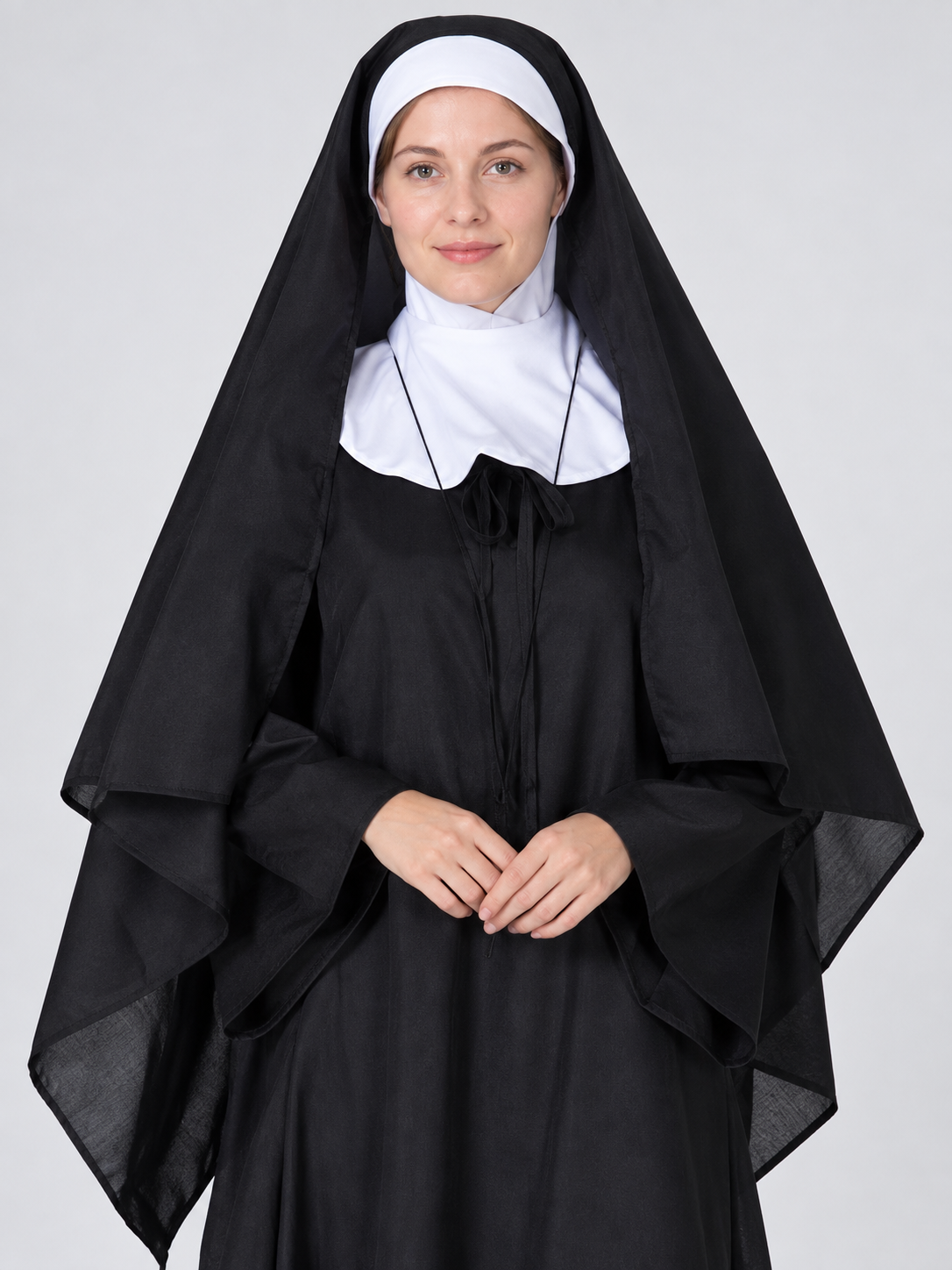 Long black and white costume with headpiece and veil