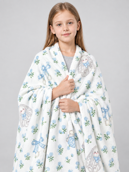 Reversible white blanket with a rabbit and bow pattern