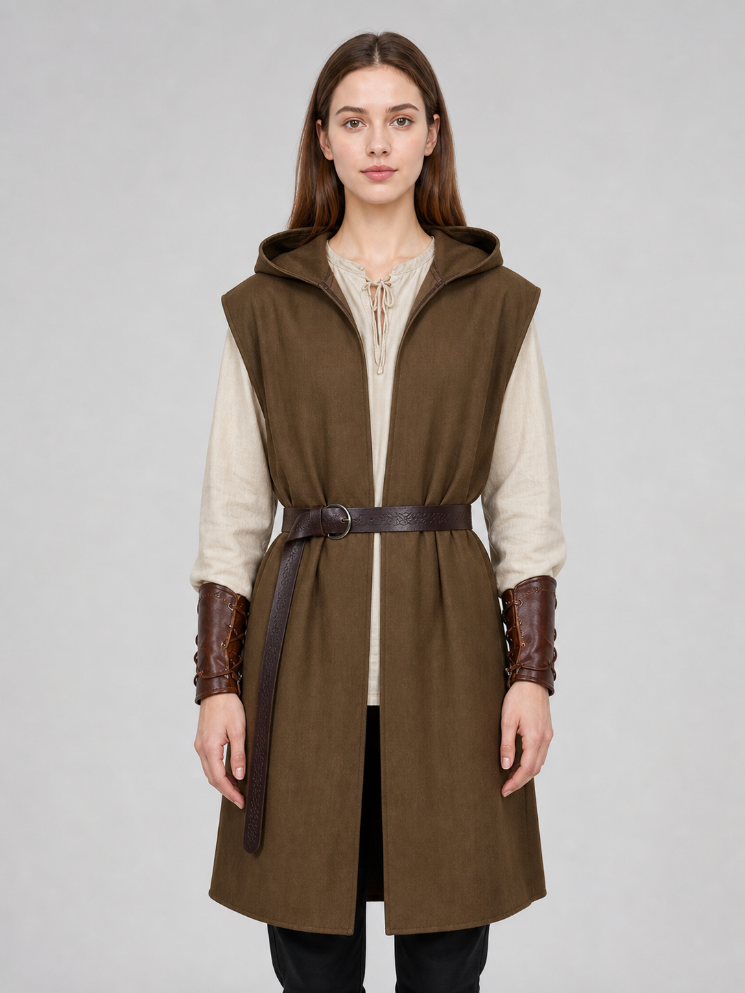 Front view of a brown hooded vest with a dark belt and cream shirt, worn with brown forearm bracers by a female model