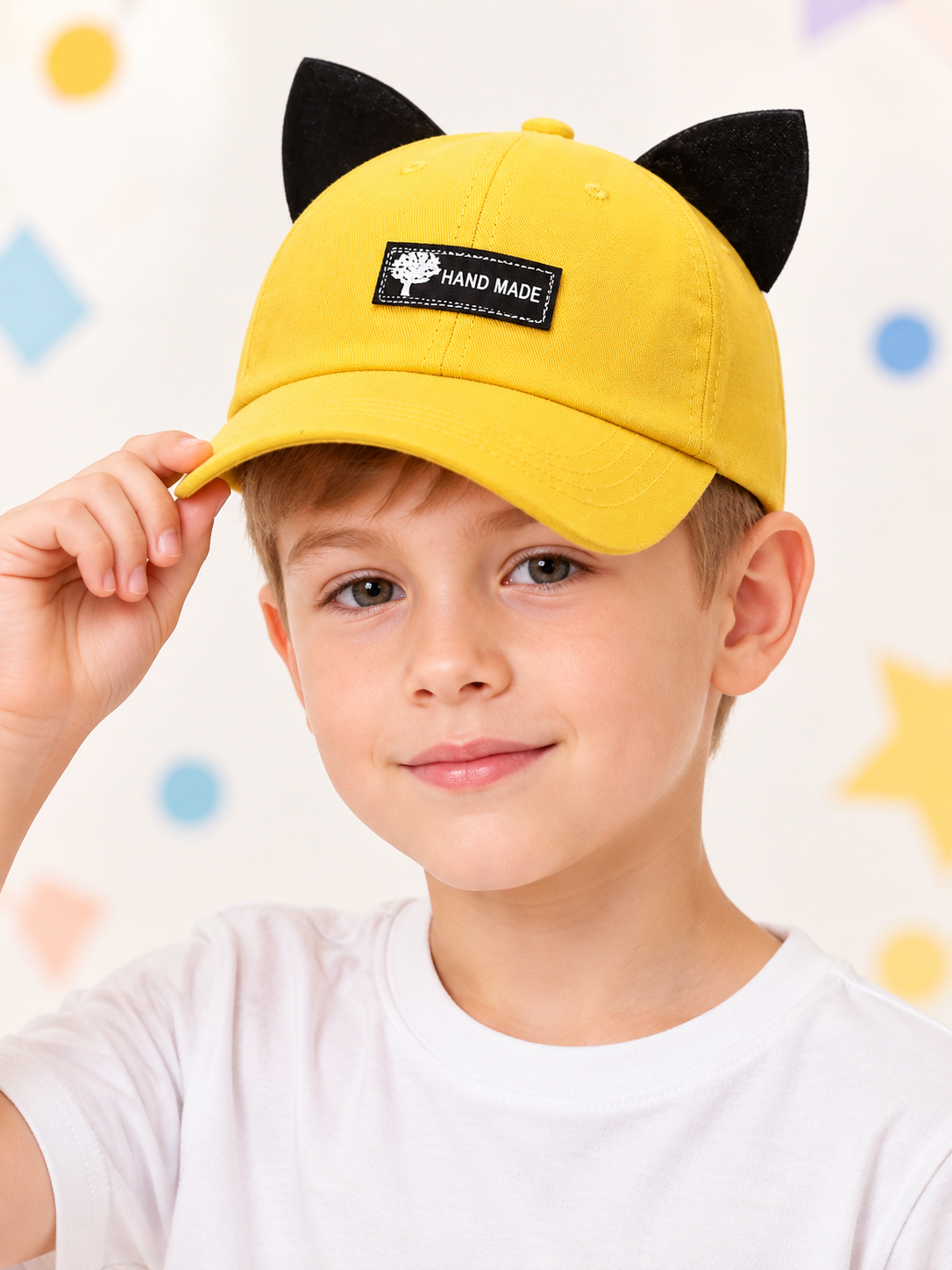 Yellow baseball cap with black ears and patch