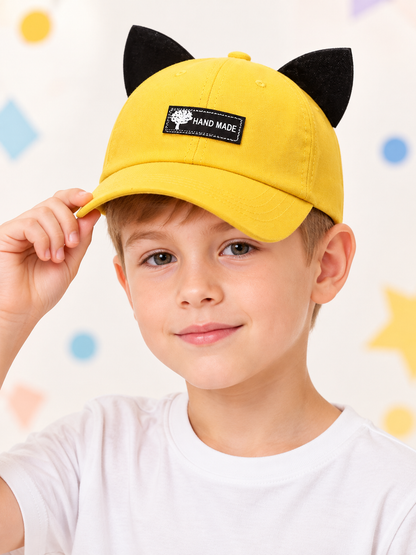 Yellow baseball cap with black ears and patch