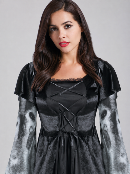 This costume dress for a Halloween look is designed in a gray-and-black color scheme. The dress features a distinctive ghost-face pattern positioned on the lower and middle sections of the garment, complemented by fabric inserts with a gray