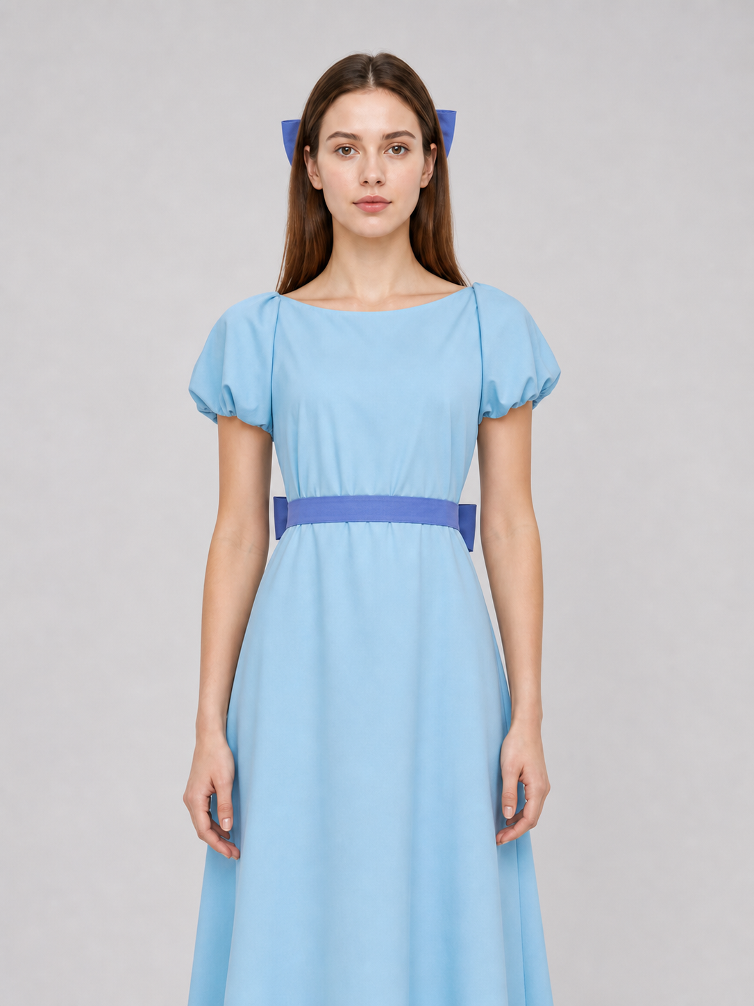 Peter Pan cosplay dress in light blue with contrasting purple-blue details. This style features a round neckline, short sleeves, and a long silhouette with a fitted upper body and a flared A-line skirt. The waist has contrasting ties that a