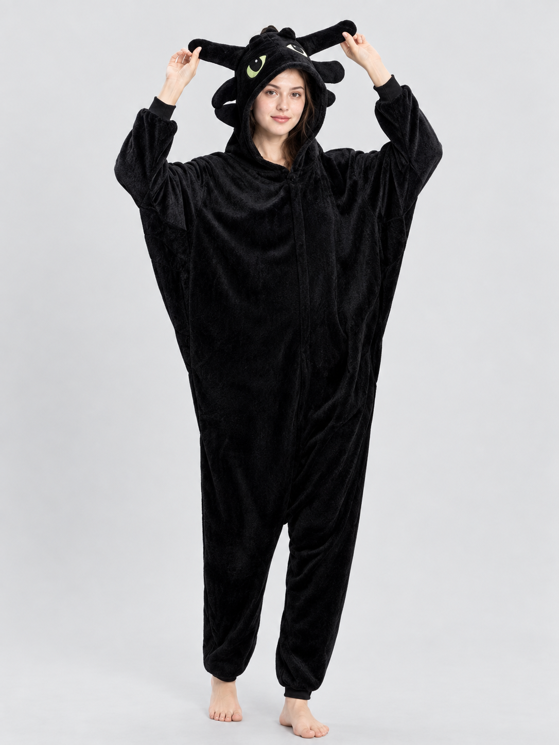 Black and white pajama jumpsuit with a hood and ears