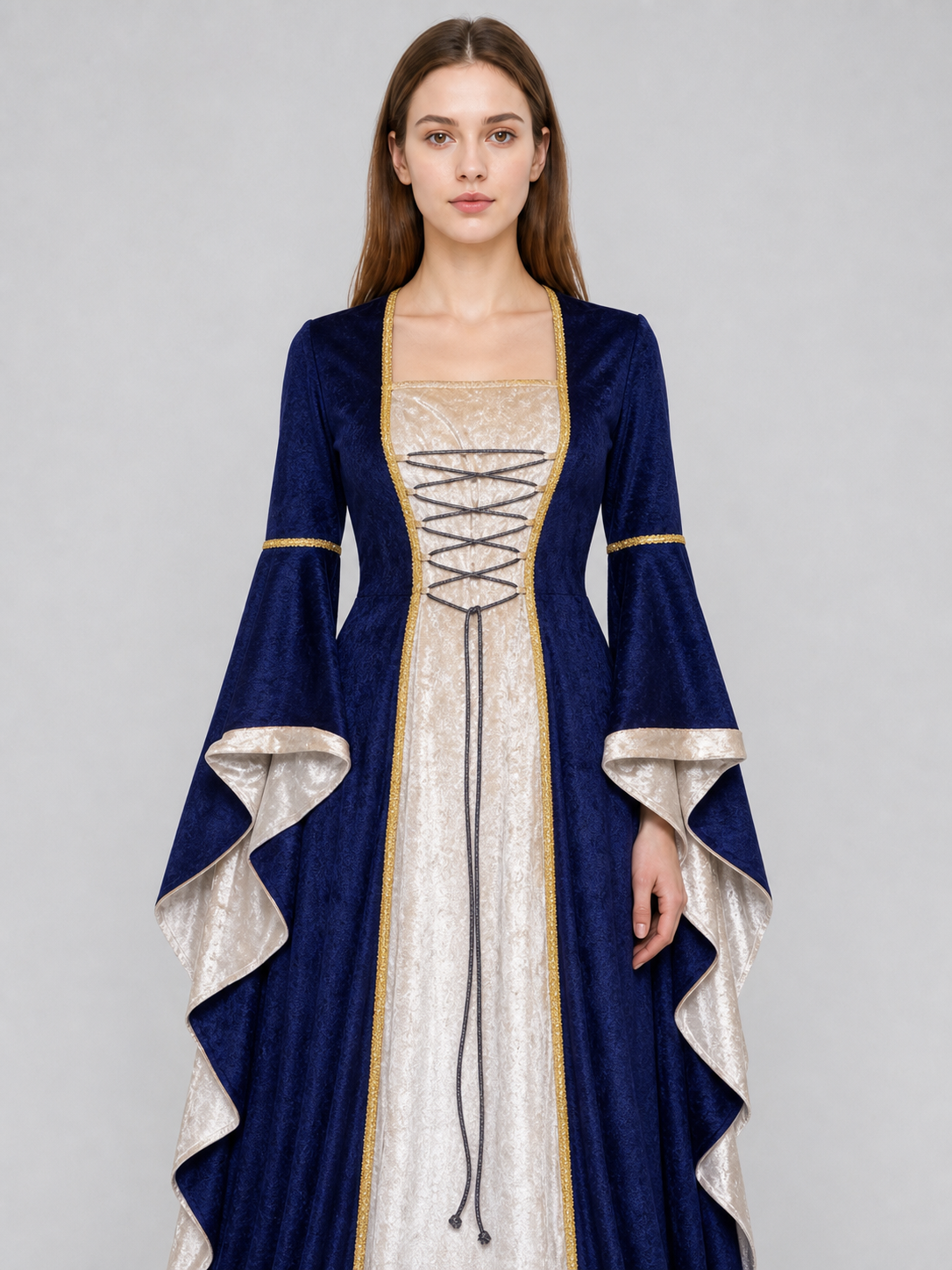 Gothic medieval-style dress made of textile fabric, featuring a floor-length design with a full skirt and flared sleeves. The sleeves are accented with tiered ruffles that emphasize the costume’s historical character. The main color is deep