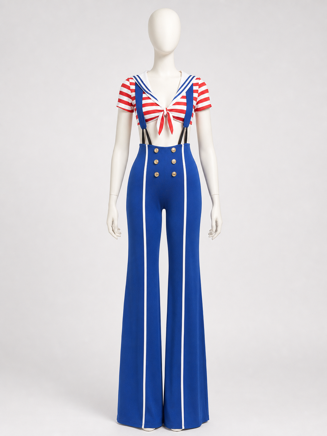 The set features a nautical style and consists of a short-sleeved top and suspender pants. The design combines white, red, blue, and gold colors. The top is decorated with red-and-white horizontal stripes, front lacing, and an open waistlin