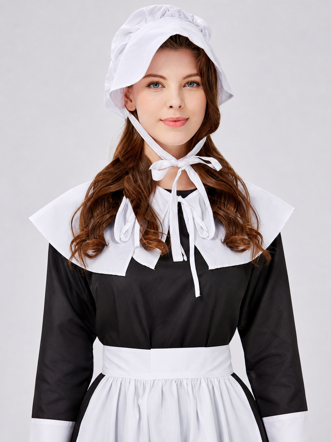 The uniform costume is designed in a black-and-white color scheme and combines elements of a classic maid outfit with a stage costume format. The model creates a complete look with a black top and skirt, long sleeves, white cuffs, a wide wh
