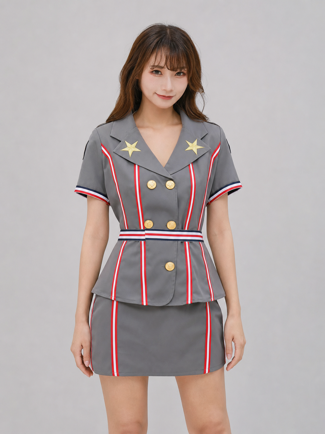 The set is designed in the style of a professional uniform and includes a short-sleeved top with a notched collar paired with a matching skirt. The design features gray, dark blue, red, gold, and black colors. The front of the top has red, 